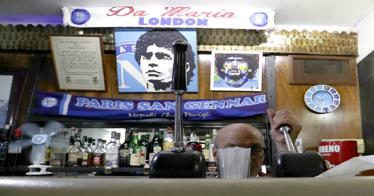 Napoli fan , Champions League spotlight , Maradona , god-like status